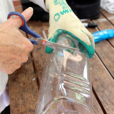 Cutting the top of a plastic bottle